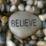 smooth stones with word Believe